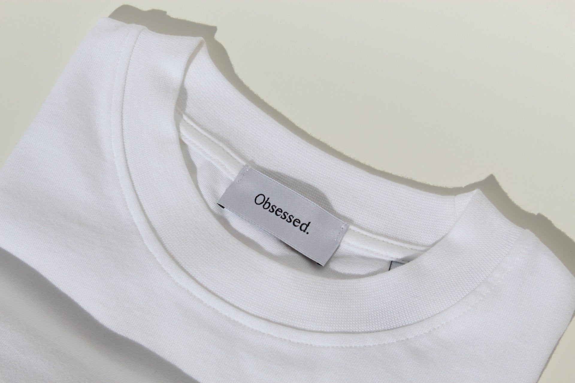 COLLEGE OF OBSESSION WHITE OBSESSED GLOBAL